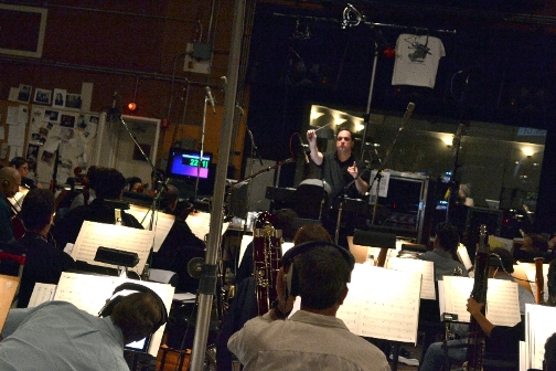 Joe Kraemer conducts the orchestra on the scoring session for Jack Reacher